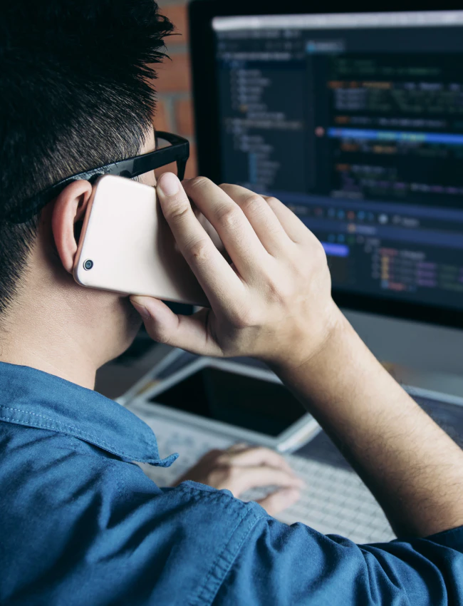 close up shot of IT worker talking to his client through phone call